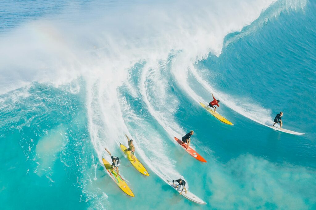 alt="surfers in hawaii"